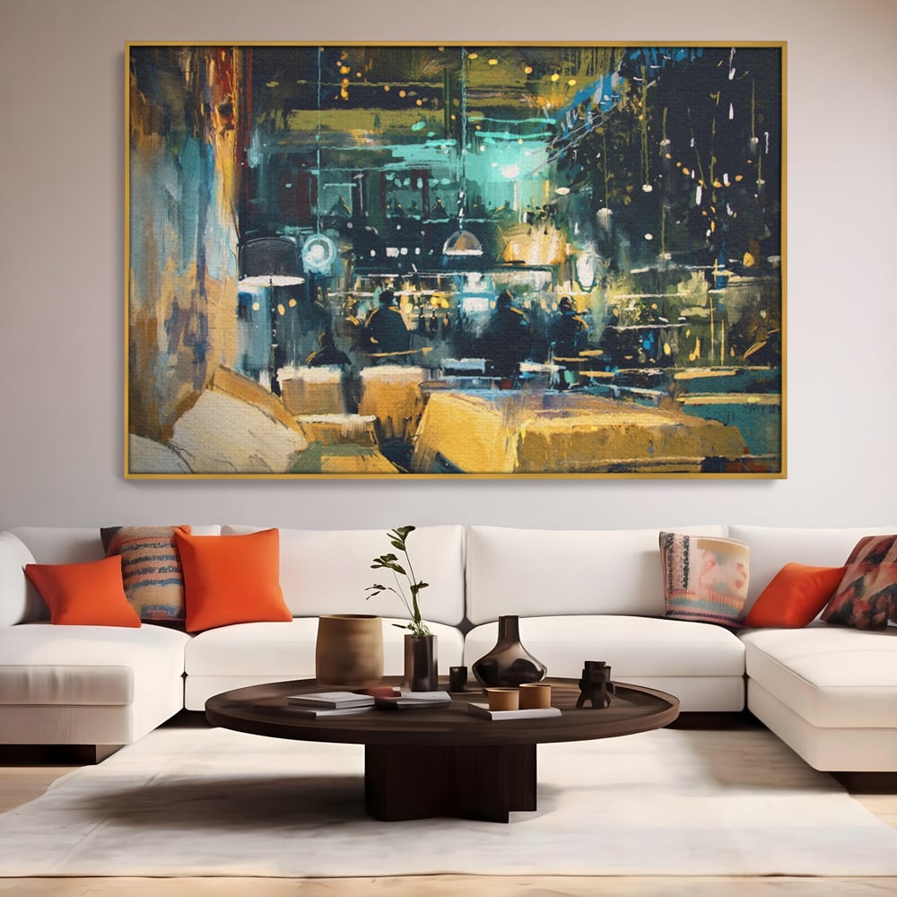 Tablou canvas cu pictura cu cafenea nocturna si lumini, in rama de aluminiu auriu, pe perete intr-un living
